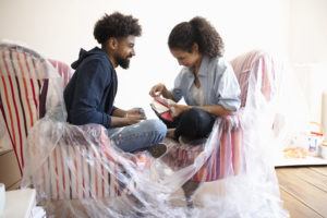 Young couple looking at paint swatches.