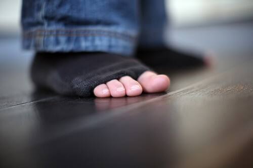 Toes poking through sock