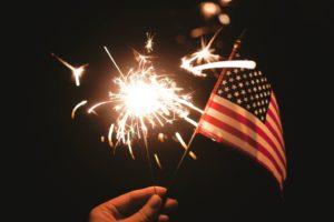 Fourth of July sparkler and flag