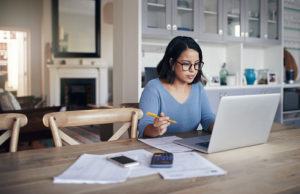 Woman at desk working on computer