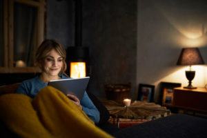 Woman reading on her tablet