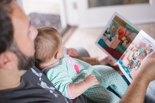 Father reading to baby