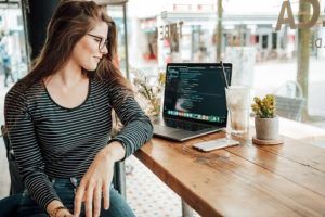 Woman looking at spreadsheet on laptop