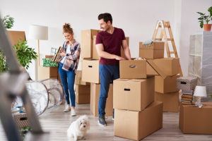 Man and woman unloading boxes in their new apartment