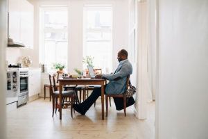 Man working from home at his kitchen table