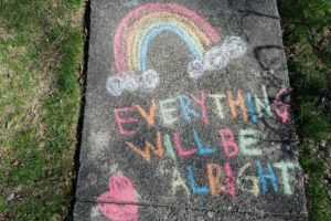 Everything Will Be Alright sign on sidewalk