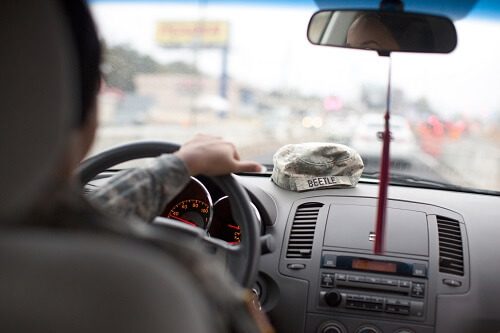 Soldier driving car