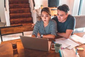 Couple researching on the computer