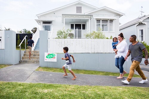 Family running into home together