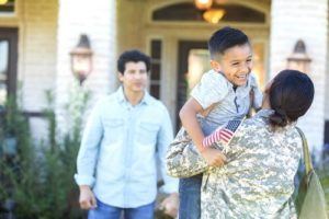 Female Soldier Greeting Family