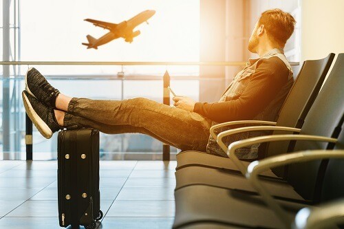 Man waiting for flight in airport