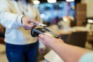 Woman paying with a contactless credit card