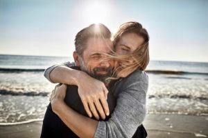 Couple hugging on beach