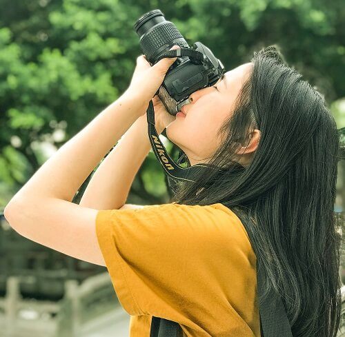 Woman taking a photograph