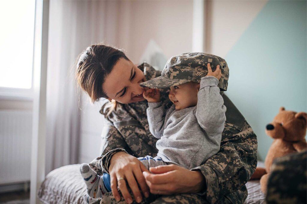 Military mom in uniform with son