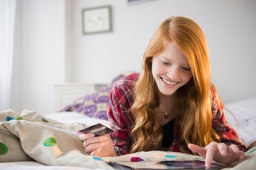 Teenage girl with credit card