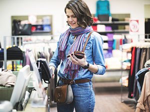 Woman shopping using a credit card.