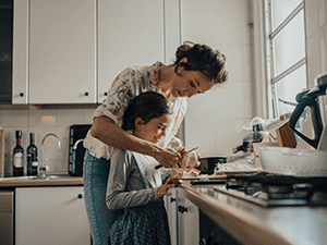 Mother and daughter cooking