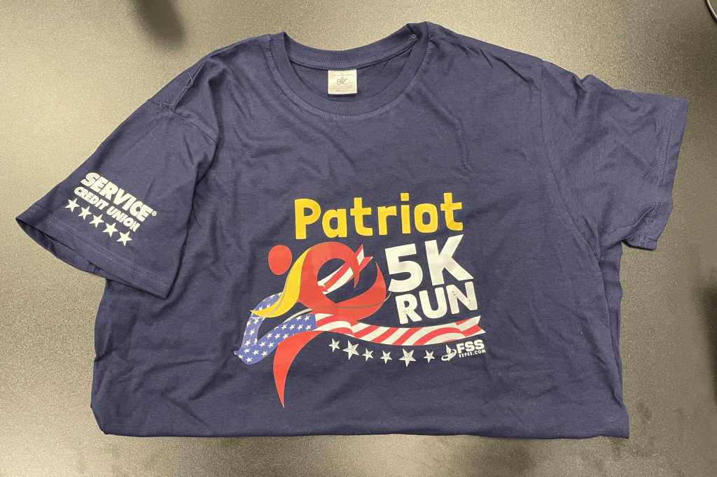 Participants in the run received event shirts featuring the Service CU logo on the sleeve.