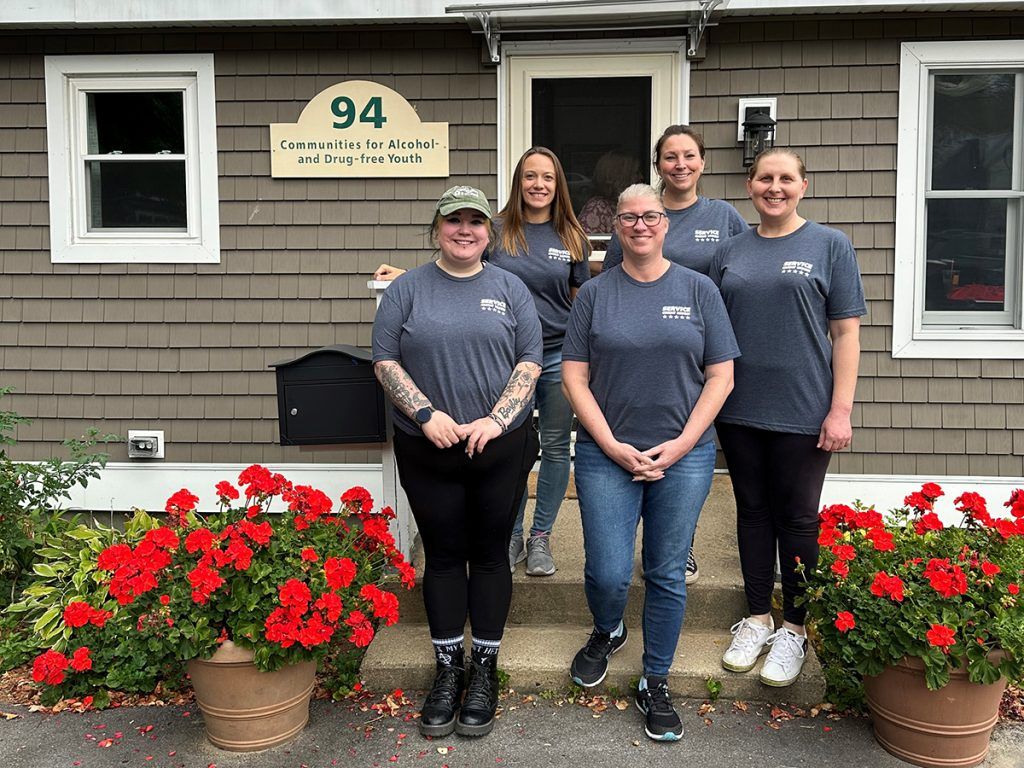 Service CU volunteers helped paint rooms at the Communities of Alcohol and Drug-Free Youth center during Day of Caring.