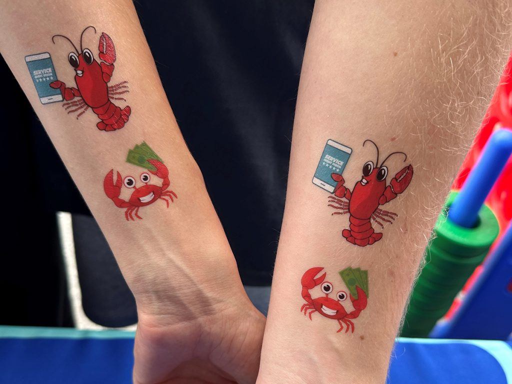 Service CU gave out themed temporary tattoos for the annual Hampton Beach Seafood Festival.