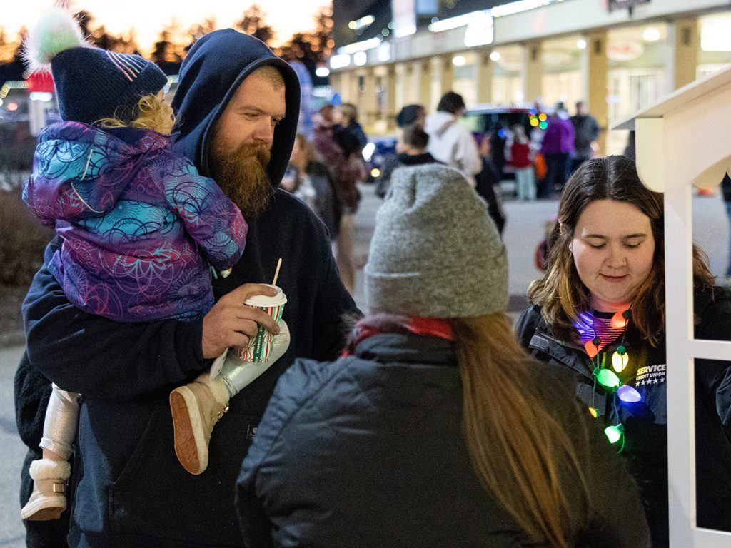 Service CU volunteers handed out hot cocoa to attendees at the Holiday Tree Lighting.