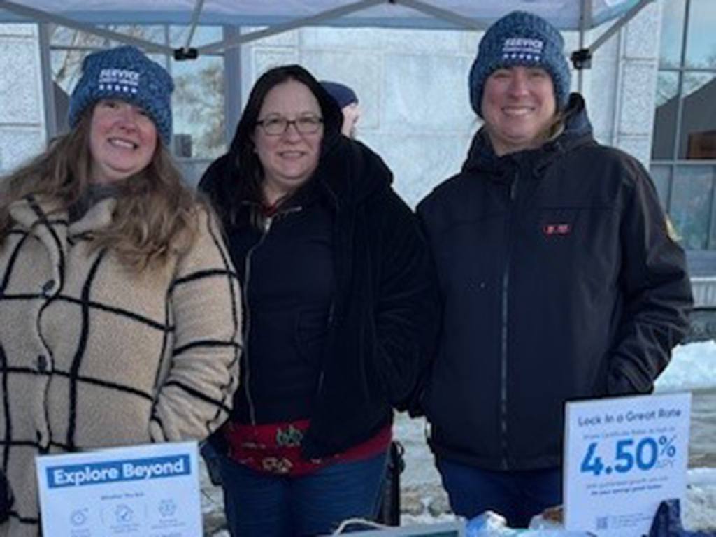 Service CU volunteers bundled up with the outdoor fun at the annual Concord Winter Festival.