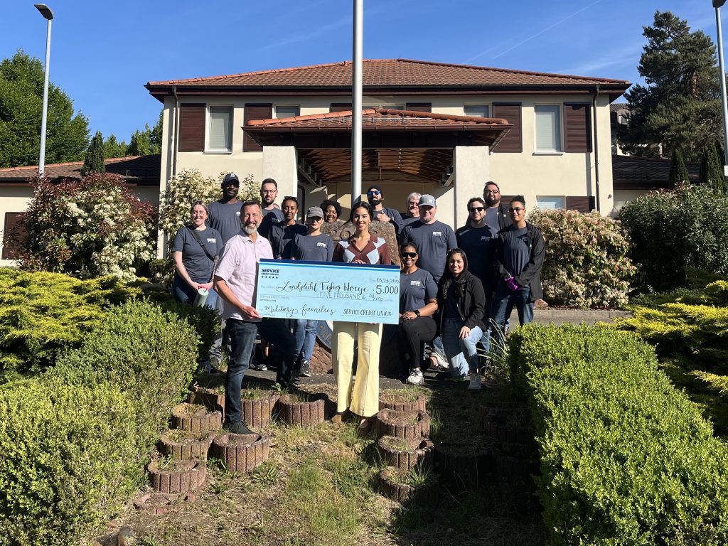 In addition to volunteering at the Landstuhl Fisher House, Service CU presented the house a $5,000 donation to help fund their daily operations.