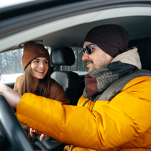 Couple driving in their car