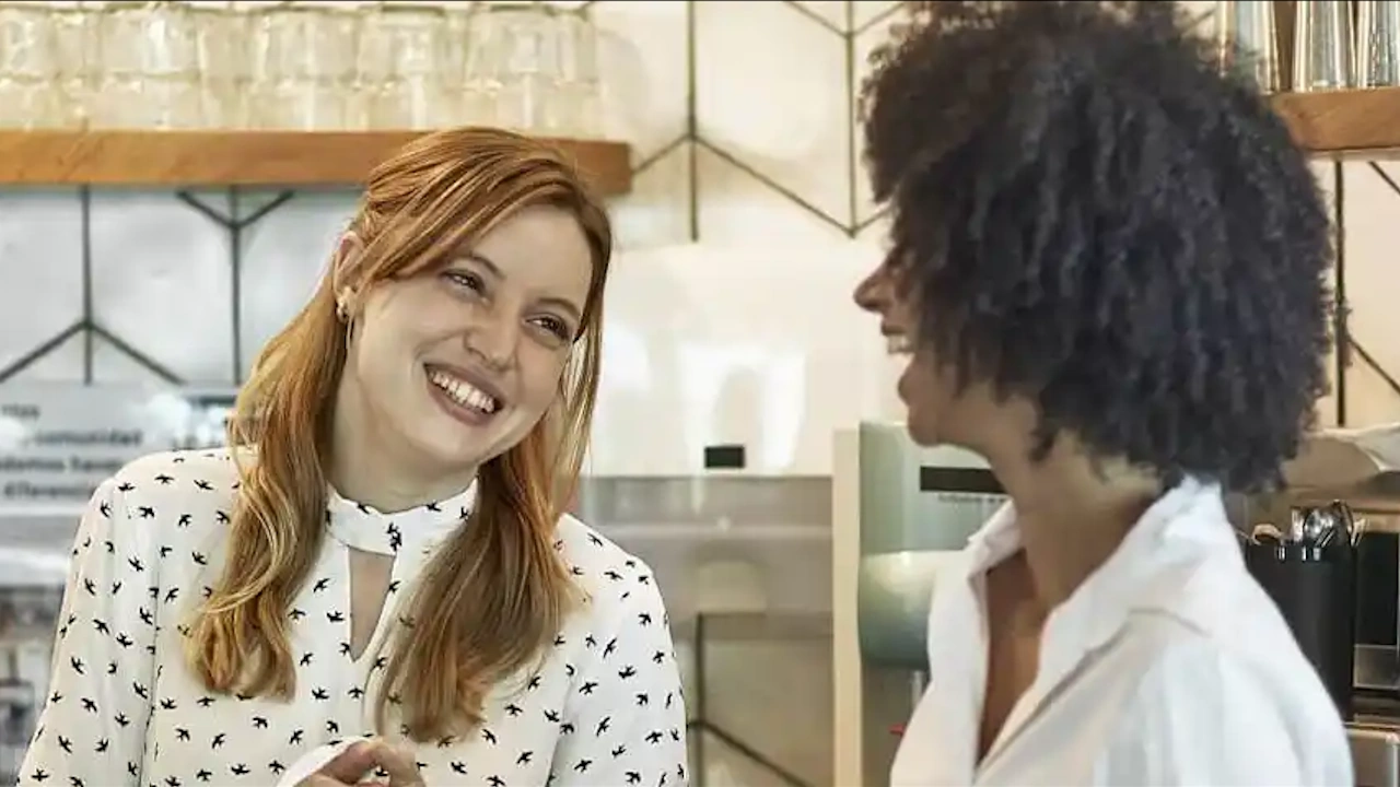 Friends laughing in a coffee shop