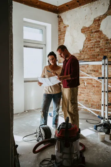 Couple reviewing home renovation plans