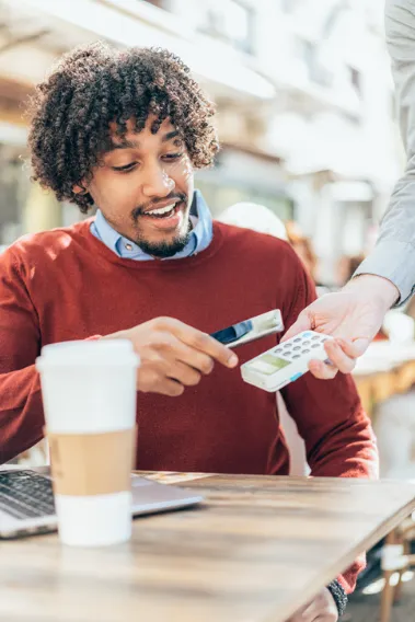 Man paying at cafe
