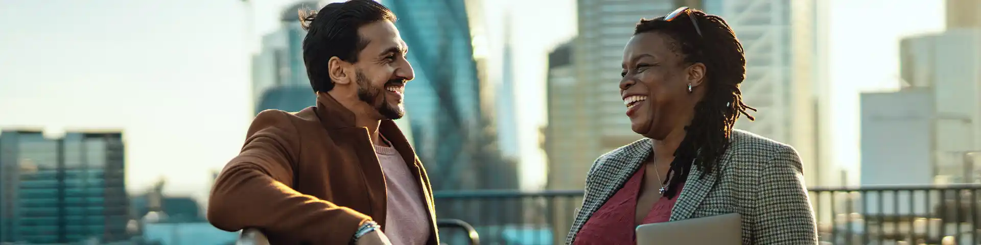 A businessman and a businesswoman talking