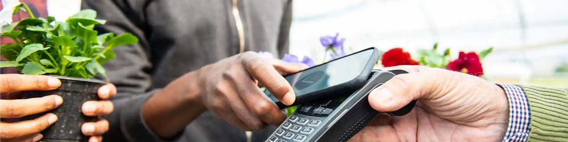 someone using their phone to make a tap-and-go purchase