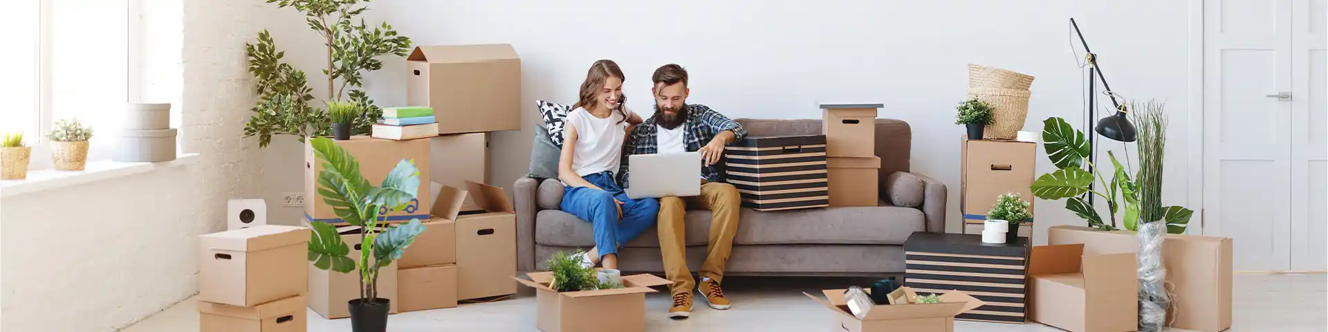 couple who just moved in making decisions on their laptop