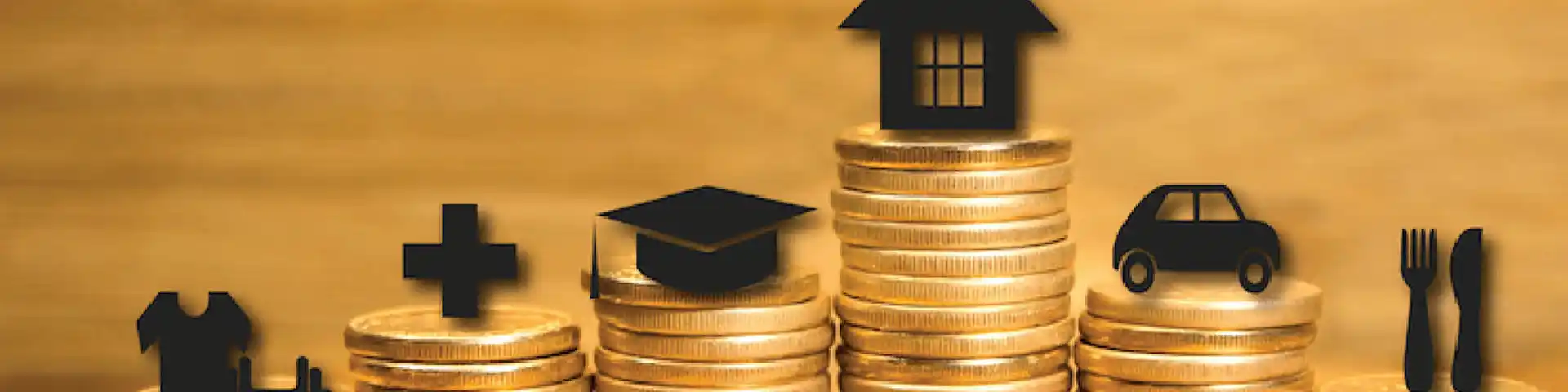 gold coins stacked up with various icons regarding home, food, car, etc