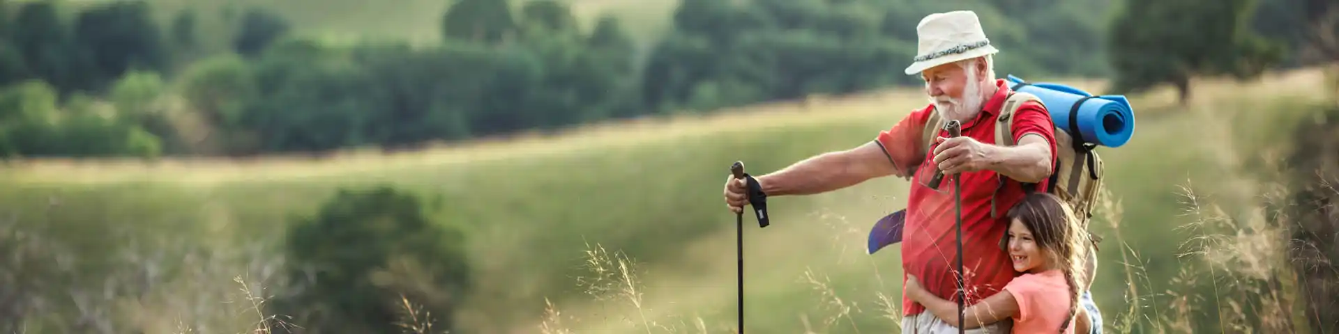 grandfather and granddaughter out hiking